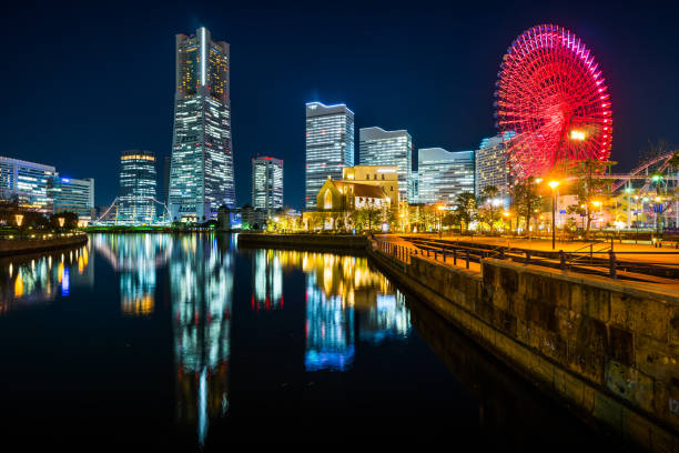 istock city skyline looking up night view in Yokohama 1176514163