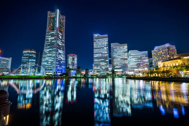 istock city skyline looking up night view in Yokohama 1176514221