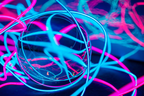 istock neon abstract wires backgroun with glass sphere 1176514380