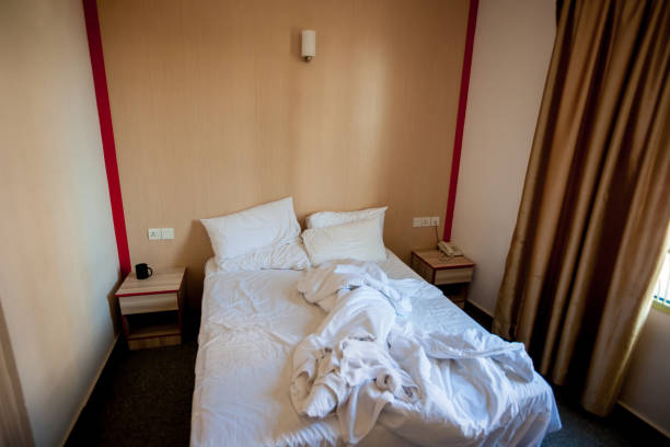 istock Crumpled bed in the hotel 1176514711