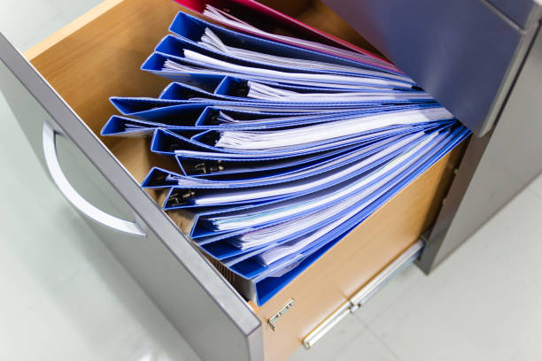 istock blue file folder documents In a file cabinet retention of contracts. 1176515733