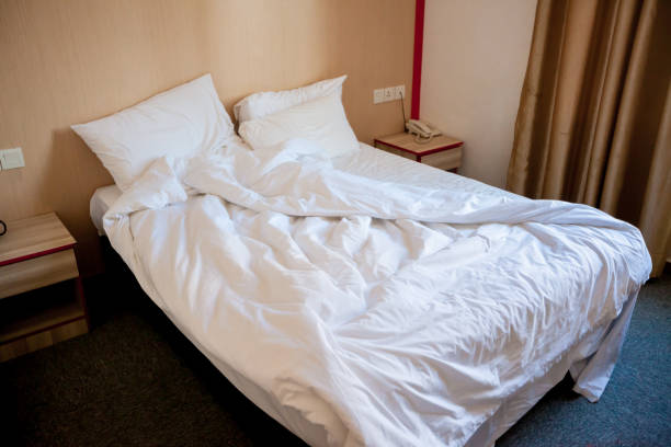 istock Crumpled bed in the hotel 1176516107