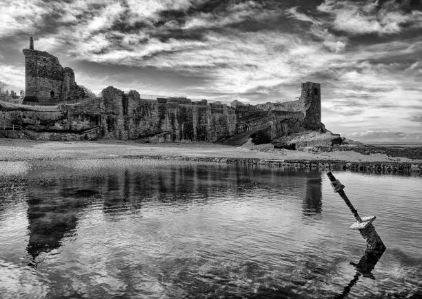 A striking black and white of the dramatic St Andrews Castle in the beautiful historic Scottish town.