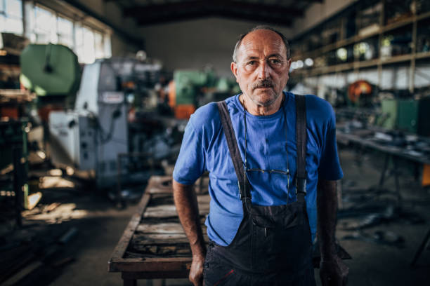 istock Mature man in factory alone 1176517333