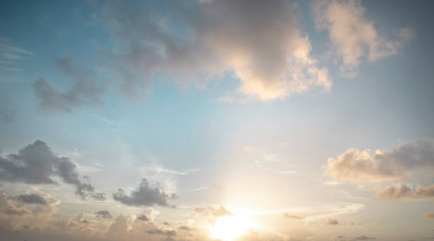 istock Beautiful morning sky at sunrise with fluffy clouds 1176518637