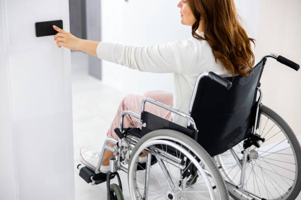 istock Adult woman pushing sensor button on wall 1176522020