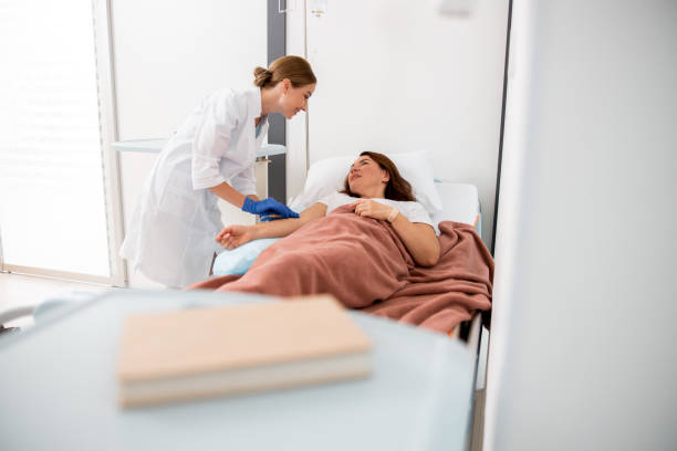 istock Smiling medic is looking on female patient 1176522326