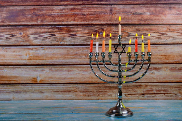 istock Brightly Glowing Hanukkah Menorah soft focus 1176523938