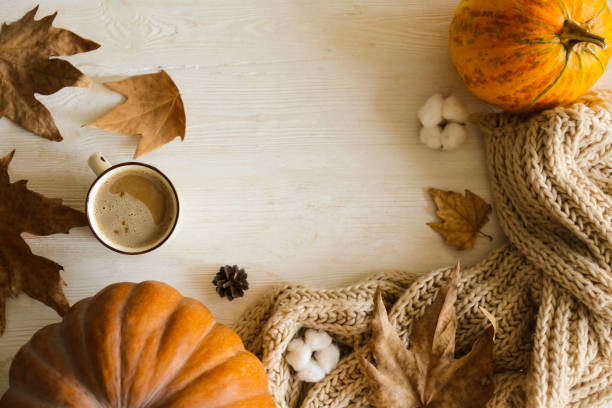 autumnal top view composition with fall season symbolics on textured background. - latté pumpkin spice coffee imagens e fotografias de stock