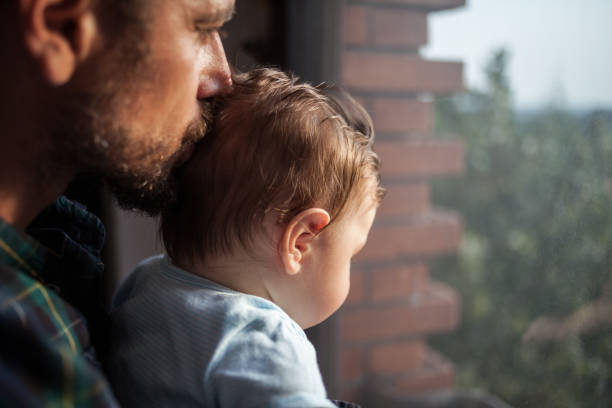 istock Father kissing his baby son 1176526187