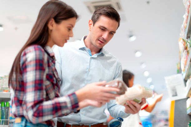 istock Couple checking ingredient at back of a rice pack 1176527370