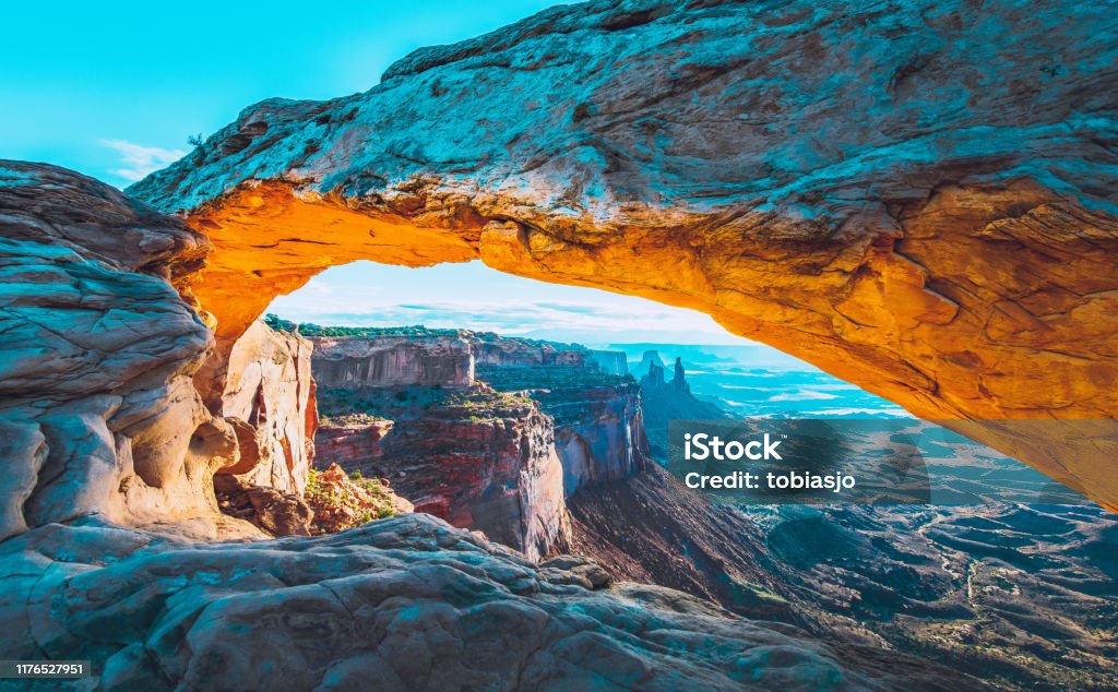 Mesa Arch Sunrise The sunrise at the Mesa Arch in the Canyonlands National Park makes the arch glow, Utah, USA. Landscape - Scenery Stock Photo