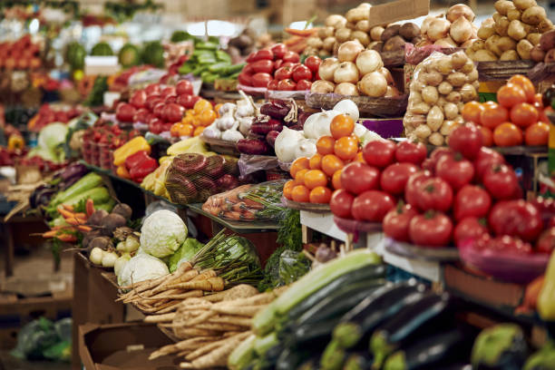istock Fresh vegetables on display counter stock photo 1176529094