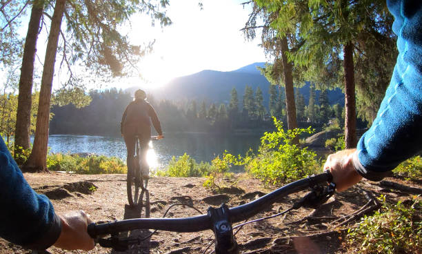 istock Couple bike through forest 1176529131