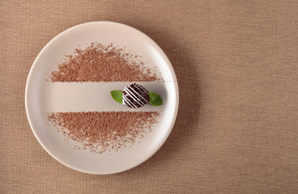 istock Chocolate ball with mint on a beige plate. 1176534433