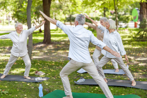 istock Group of senior people practicing qigong outdoors 1176536041