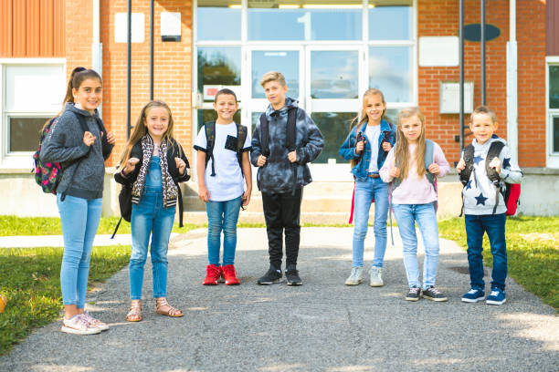istock group of kids on the school background having fun 1176536130