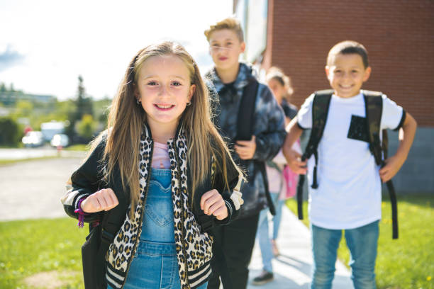 istock group of kids on the school background having fun 1176536212