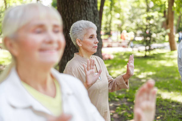 istock Senior women practicing qigong in the park 1176536539