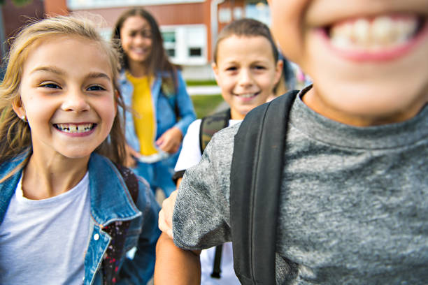 istock group of kids on the school background having fun 1176536763