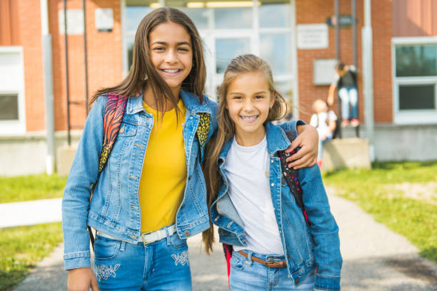 istock two kids friend on the school background having fun 1176536804