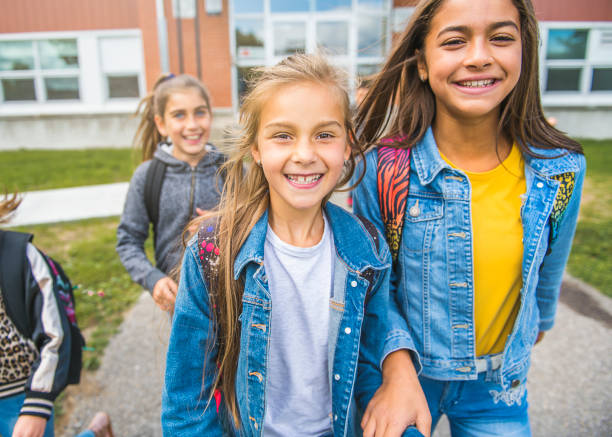 istock group of kids on the school background having fun 1176538106