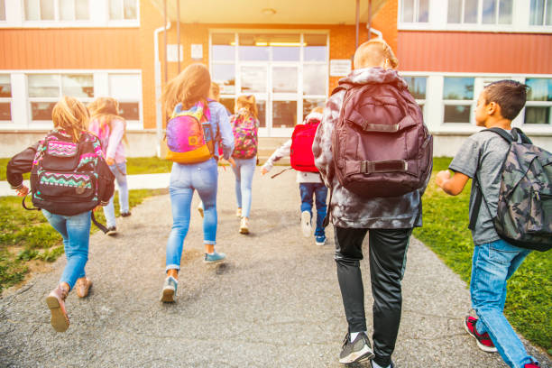 istock group of kids go to the school, Back view 1176538224
