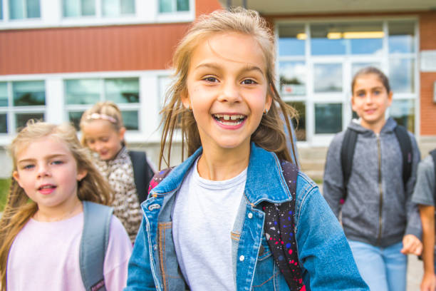 istock group of kids on the school background having fun 1176538641
