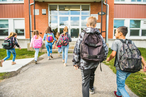 istock group of kids go to the school, Back view 1176538647