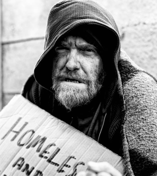 istock Homeless man begging in the street 1176542191