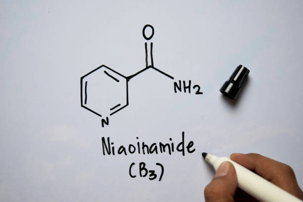 istock Niaoinamide (B3) molecule written on the white board. Structural chemical formula. Education concept 1176544764