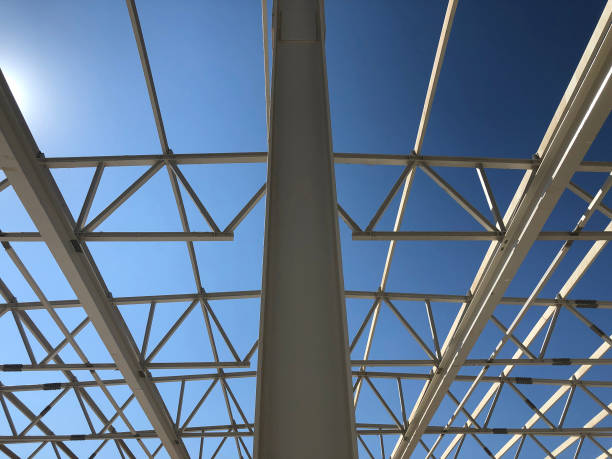 istock Truss ceiling and metal pillars and girders. Support constructions. Industrial building metal framework 1176545190