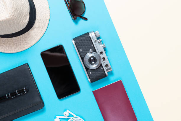 istock Essentials for modern young person travel. Camera, sunglasses, notepad, passport and hat. Easy and light travel 1176552074