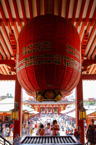 Tokyo, Japan - August 8, 2019: People Pray in Oldest temple in Tokyo and one of the most significant Buddhist temples located in Asakusa area.
