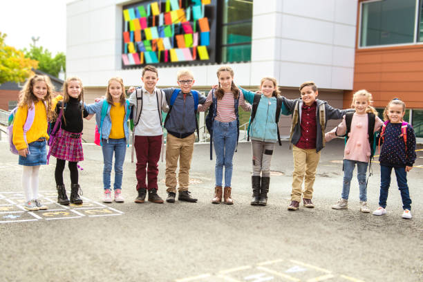 istock group of kids on the school background having fun 1176554182