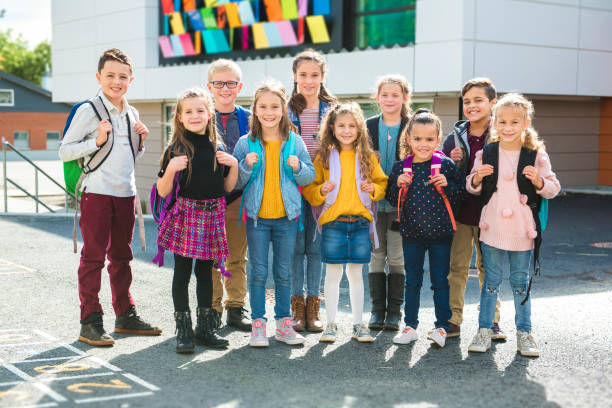 istock group of kids on the school background having fun 1176554211