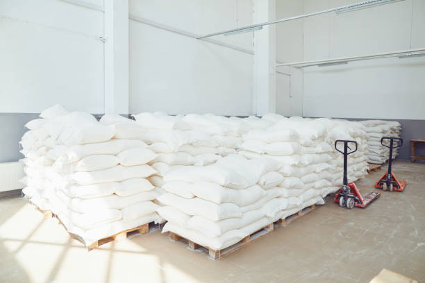 istock Folded white bags on pallets in factory storage. 1176554566