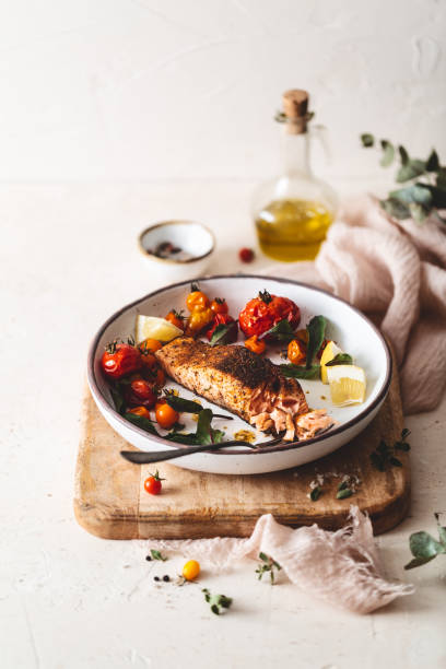 Grilled salmon with Cajun Spices and Roasted Tomatoes Grilled Salmon with Cajun Spices and Roasted Tomatoes cajun food photos stock pictures, royalty-free photos & images