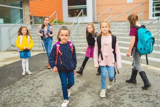istock group of kids on the school background having fun 1176555420