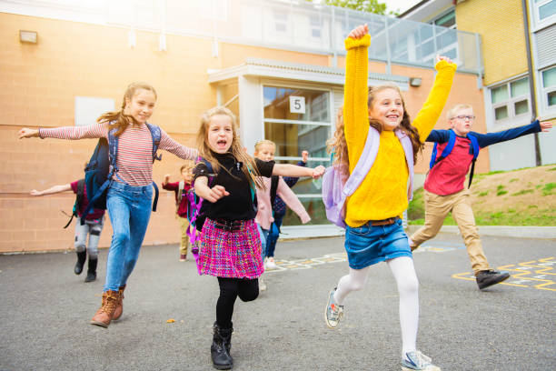 istock group of kids on the school background having fun 1176556884