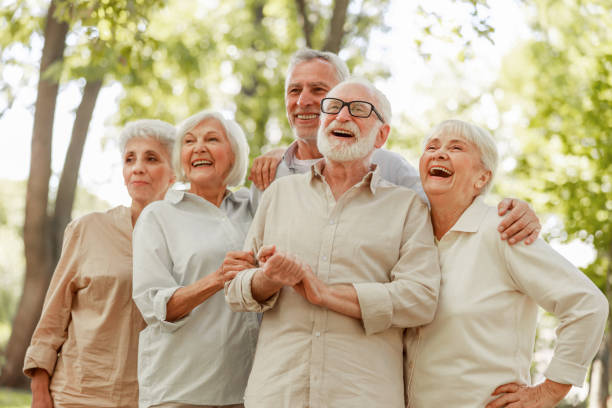 istock Cheerful old friends standing on the street 1176557113
