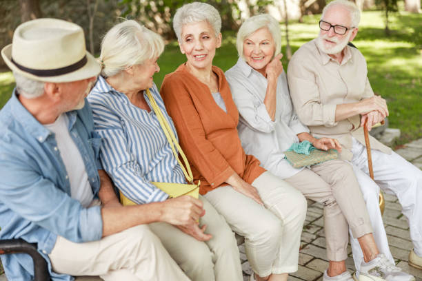 istock Group of old people chatting on the street 1176557369