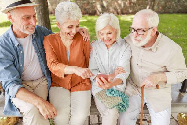 istock Cheerful old people watching video on cellphone 1176557463