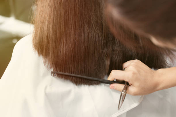 istock women hair cutting at salon 1176557528
