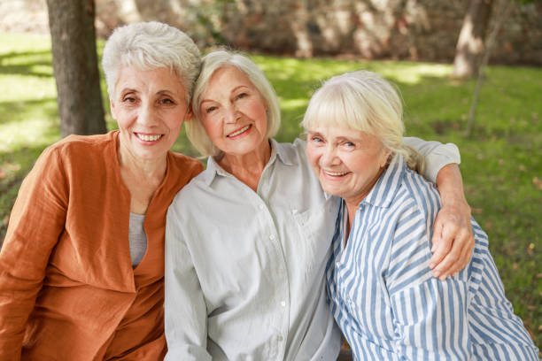 istock Three old women looking at camera and smiling 1176557535