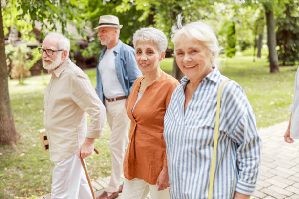 istock Cheerful senior people walking on the street 1176557569