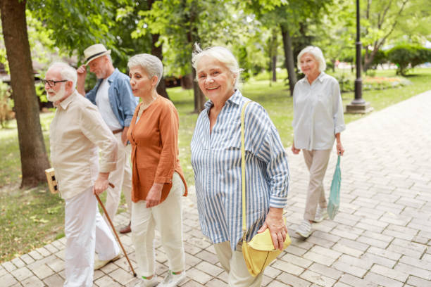 istock Happy senior people walking on the street 1176557622
