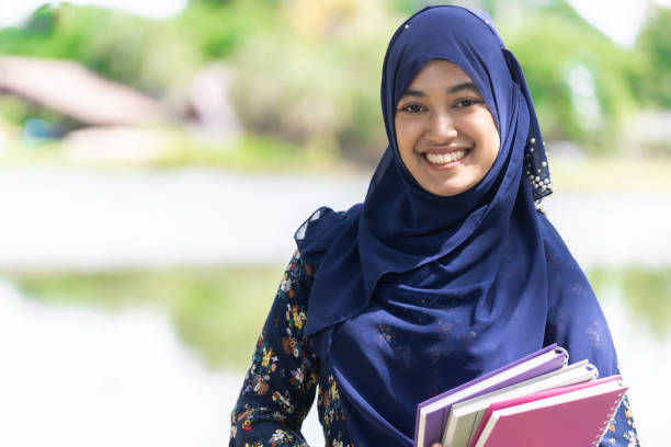 muslim girl student portrait Portrait of good-looking Happy young teenager Muslim islamic asian university girl indonesian culture photos stock pictures, royalty-free photos & images