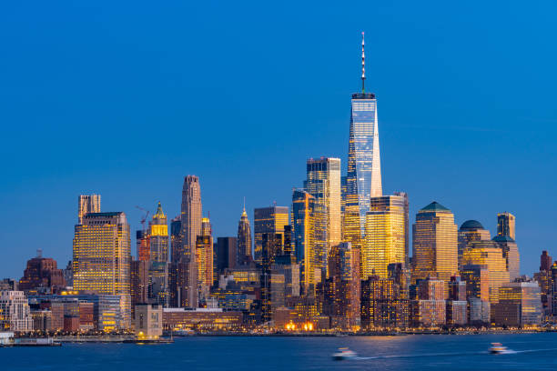 Lower Manhattan New York Aerial view of New York city Manhattan skyline cityscape at dusk from New Jersey. lower manhattan stock pictures, royalty-free photos & images