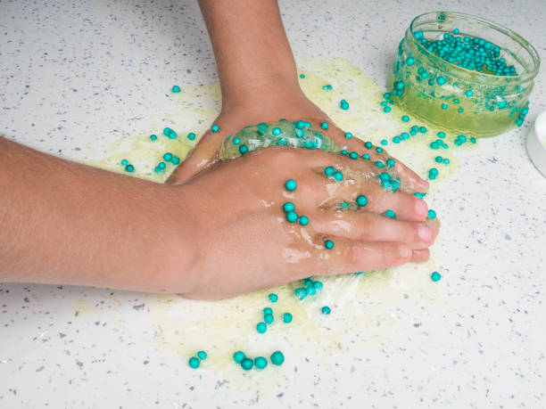 istock Games mucus in child hand on a white background 1176561857
